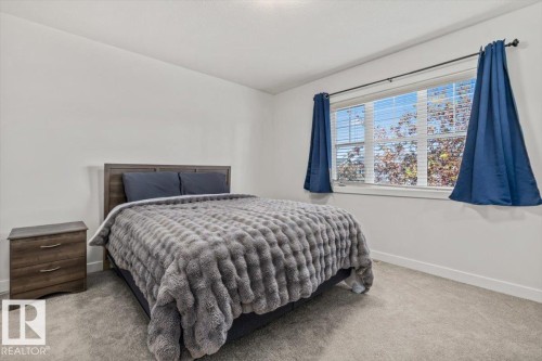 Bedroom featuring light-colored walls and grey carpet flooring - 125 Birchwood Close, Devon, AB 