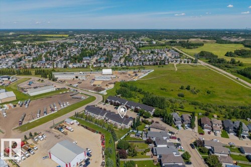 Aerial perspective showcasing a residential community with varied housing styles - 125 Birchwood Close, Devon, AB 