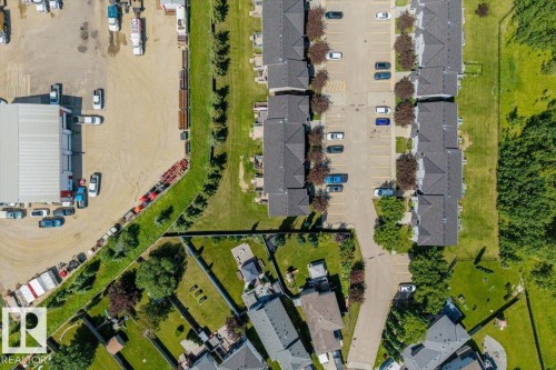 Aerial perspective showcasing residential properties with gray shingled roofs - 125 Birchwood Close, Devon, AB 