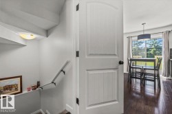 Interior white paneled door with matte black hardware - 