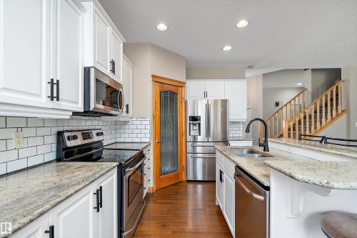 13 Southfork Court, Leduc, AB - Indoor Photo Showing Kitchen With Double Sink With Upgraded Kitchen