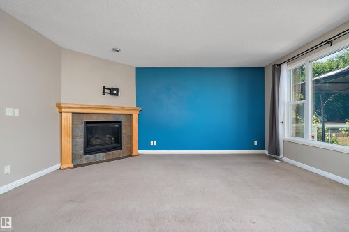 13 Southfork Court, Leduc, AB - Indoor Photo Showing Living Room With Fireplace