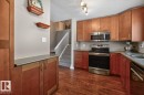 Kitchen featuring Stainless Steel Appliances, Ample Cabinets, Counter Space, and Storage with South Facing Window overlooking your Private Backyard. - 18655 61 Avenue, Edmonton, AB 