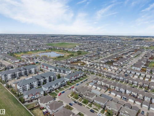 Expansive residential development featuring a variety of housing types, including multi-story apartment buildings and single-family homes - 3340 15A Avenue, Edmonton, AB 