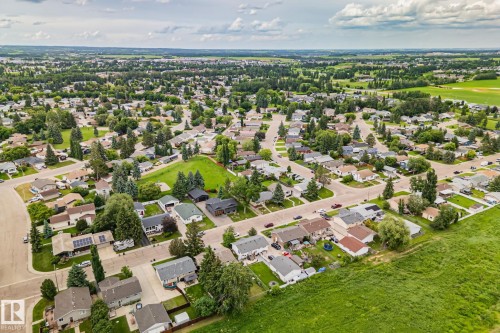 Expansive aerial showcasing a residential neighborhood with varied home styles - 30 Garden Valley Drive, Stony Plain, AB - Outdoor With View