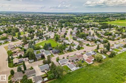 Expansive aerial showcasing a residential neighborhood with varied home styles - 