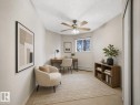 Neutral tone walls with carpeted flooring - 143 10636 120 Street, Edmonton, AB 