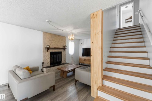 4335 53 Avenue, Tofield, AB - Indoor Photo Showing Other Room With Fireplace