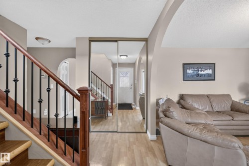 Wood-finish flooring extending from the entryway - 3841 62 Street, Edmonton, AB 