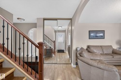 Wood-finish flooring extending from the entryway - 