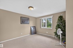 Carpeted room with neutral wall paint and white trim - 
