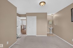 Carpeted interior area with neutral wall tones - 