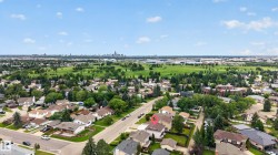 Aerial perspective showcasing the property within a residential setting - 