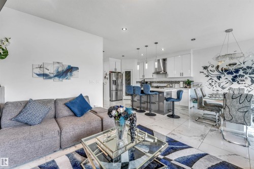 Open-concept living space featuring high ceilings and recessed lighting - 5809 65 Street, Beaumont, AB - Indoor Photo Showing Other Room