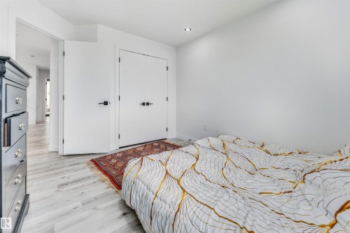 Bright room featuring light wood-finish flooring and recessed ceiling lighting - 5809 65 Street, Beaumont, AB - Indoor Photo Showing Bedroom