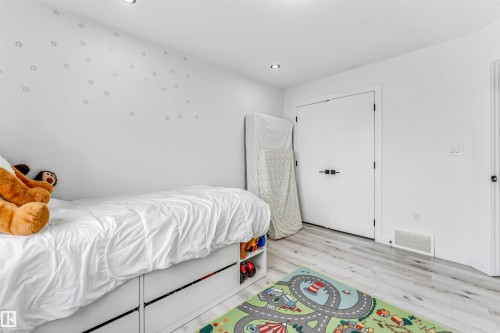 Room featuring light wood-finish flooring and recessed ceiling lighting - 5809 65 Street, Beaumont, AB - Indoor Photo Showing Bedroom