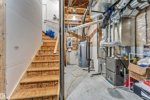 Unfinished basement with concrete flooring and exposed structural beams - 5809 65 Street, Beaumont, AB - Indoor Photo Showing Basement