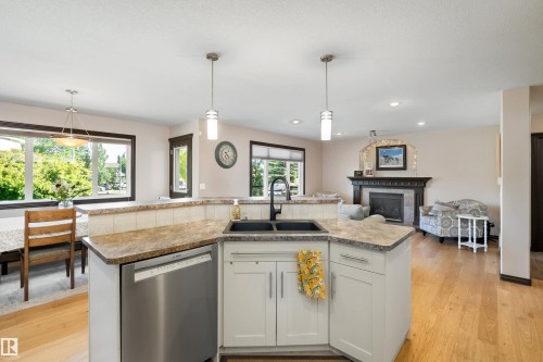 12 Henderson Bay, Spruce Grove, AB - Indoor Photo Showing Kitchen With Fireplace With Double Sink