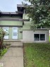 Multi-level facade with light green siding and dark brown trim accents - 482 Lee Ridge Road Nw, Edmonton, AB 