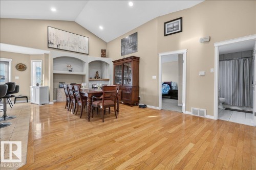 Spacious room featuring wood-finish flooring and a vaulted ceiling with recessed lighting - 6050 164A Avenue, Edmonton, AB - Indoor Photo Showing Dining Room
