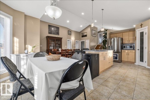 Open-concept living space with vaulted ceilings, recessed lighting, and tile flooring - 6050 164A Avenue, Edmonton, AB - Indoor Photo Showing Other Room