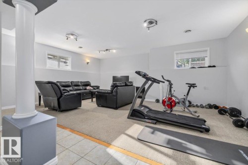 Spacious recreational area featuring recessed lighting and a support column - 6050 164A Avenue, Edmonton, AB - Indoor Photo Showing Gym Room