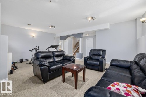 Carpeted recreation room featuring light gray walls, white trim, and recessed lighting - 6050 164A Avenue, Edmonton, AB - Indoor Photo Showing Living Room