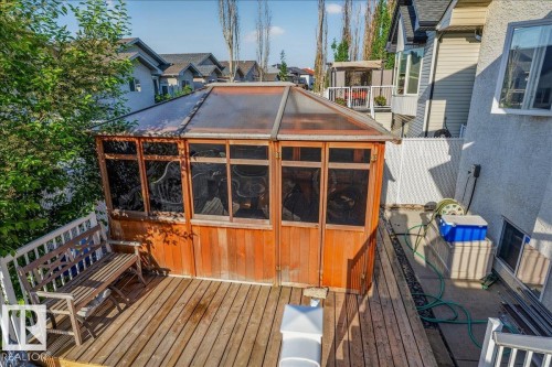Wood-finish deck featuring a built-in gazebo with a translucent roof and multiple window panels - 6050 164A Avenue, Edmonton, AB - Outdoor With Deck Patio Veranda
