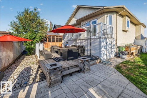 Multi-level outdoor living space featuring a stamped concrete patio, wood-finish deck, and gravel landscaping - 6050 164A Avenue, Edmonton, AB - Outdoor With Deck Patio Veranda With Exterior