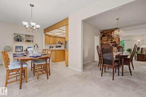 Carpeted interior with light-toned walls and built-in shelving - 9516 146 Street, Edmonton, AB 