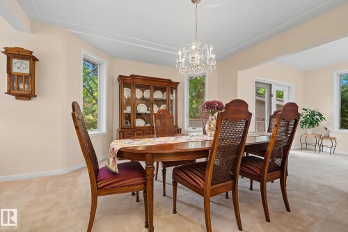 Dining area with neutral carpet flooring and light-toned walls - 9516 146 Street, Edmonton, AB 