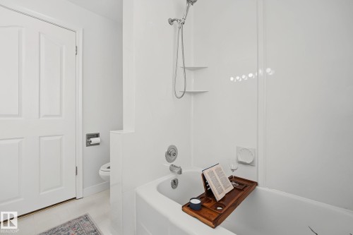 Bathtub with white surround and chrome fixtures - 9516 146 Street, Edmonton, AB 