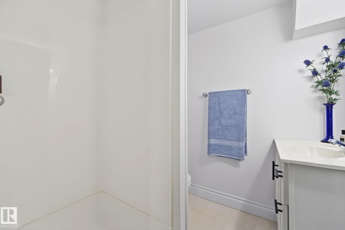 White shower stall with an integrated soap dish - 9516 146 Street, Edmonton, AB 