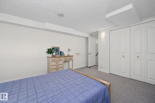 White walls with gray carpet flooring and recessed lighting - 9516 146 Street, Edmonton, AB 