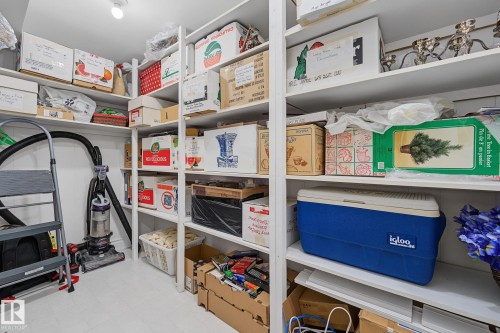 Built-in white shelving system providing extensive storage capacity - 9516 146 Street, Edmonton, AB 