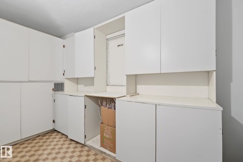 White cabinetry offering extensive storage solutions - 9516 146 Street, Edmonton, AB 