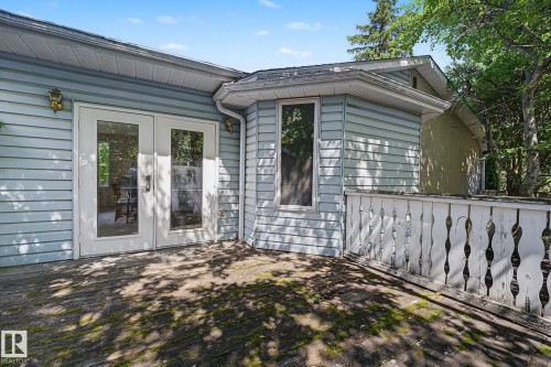 Exterior deck with light blue siding and white trim - 9516 146 Street, Edmonton, AB 
