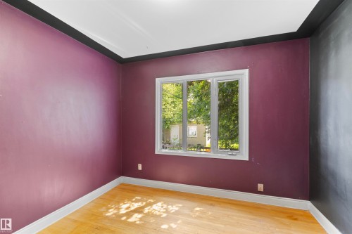 Hardwood flooring complemented by white baseboards - 10607 73 Ave, Edmonton, AB 