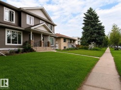 Two-story residence featuring horizontal siding and white trim - Front Lawn was rendered. - 