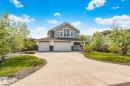 Contemporary two-story residence featuring a gray exterior with stone accents - 9 Greenfield Wynd, Fort Saskatchewan, AB  - Outdoor With Facade 