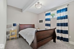 Carpeted room featuring a window with natural light, light gray wall paint, white trim, and a flush mount ceiling light fixture - 