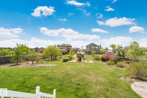 Expansive green lawn with mature trees and established landscaping - 9 Greenfield Wynd, Fort Saskatchewan, AB - Outdoor With View