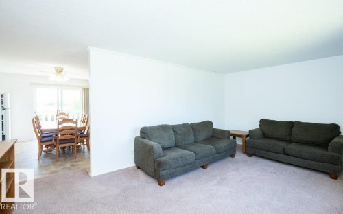 Living room featuring neutral-toned carpeting and white walls - 25023 Twp Rd 612, Rural Westlock County, AB 