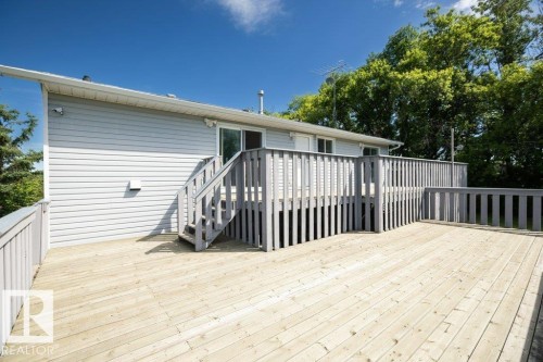 Spacious wood deck with perimeter railing - 25023 Twp Rd 612, Rural Westlock County, AB 