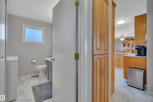Bathroom with a window, white tile flooring, and gray vanity - 184 Garwood Cres, Wetaskiwin, AB - Indoor Photo Showing Bathroom