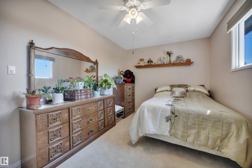 Bedroom featuring carpeted flooring and a ceiling fan with integrated lighting - 184 Garwood Cres, Wetaskiwin, AB - Indoor Photo Showing Bedroom