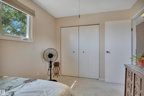 Bedroom with window, neutral wall paint, and white bi-fold closet doors - 184 Garwood Cres, Wetaskiwin, AB - Indoor Photo Showing Bedroom