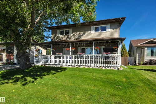 Two-story residence featuring light brown siding and white window shutters - 184 Garwood Cres, Wetaskiwin, AB - Outdoor With Deck Patio Veranda