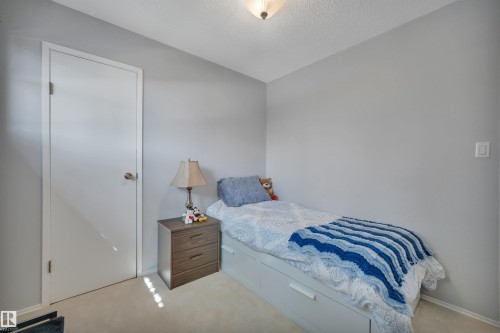 Light-toned walls complement the neutral carpet flooring - 184 Garwood Cres, Wetaskiwin, AB - Indoor Photo Showing Bedroom