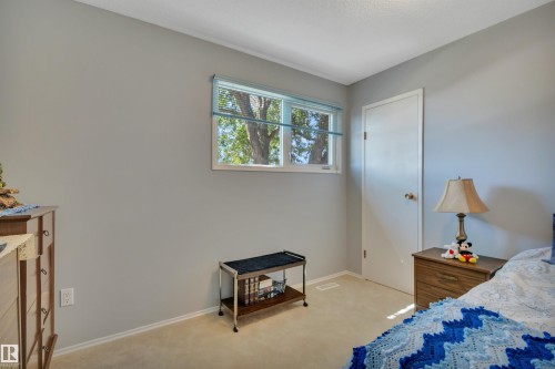 Room featuring light gray walls, white trim, and light-toned carpeting - 184 Garwood Cres, Wetaskiwin, AB - Indoor Photo Showing Bedroom